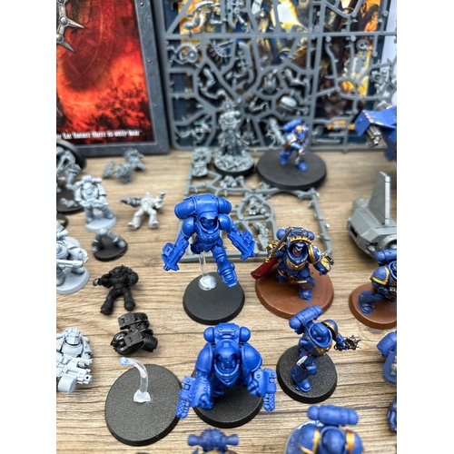 466 - A large collection of Warhammer 40K miniatures and accessories to include Space marines, Death guard... 