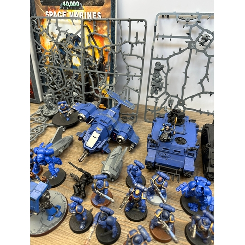 466 - A large collection of Warhammer 40K miniatures and accessories to include Space marines, Death guard... 