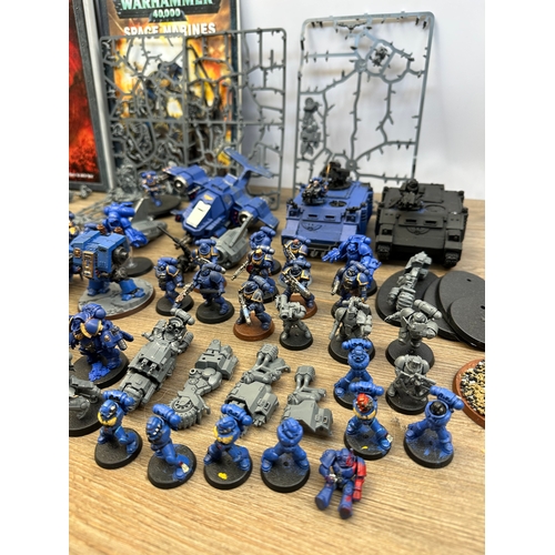 466 - A large collection of Warhammer 40K miniatures and accessories to include Space marines, Death guard... 