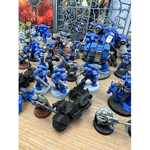 466 - A large collection of Warhammer 40K miniatures and accessories to include Space marines, Death guard... 