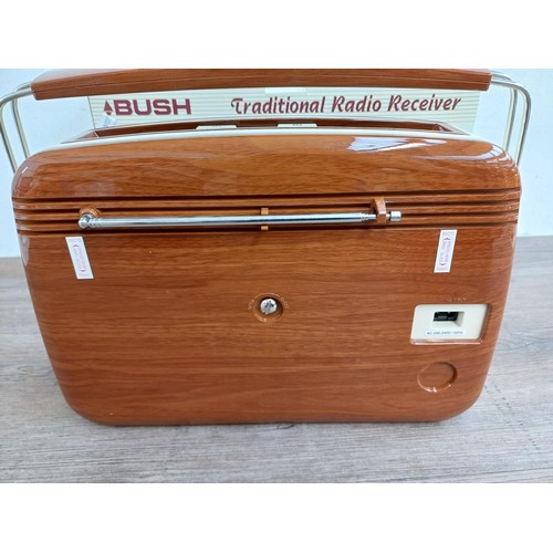 707 - A boxed Bush TR82WOOD portable three band radio