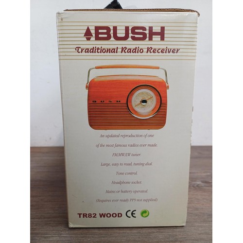 707 - A boxed Bush TR82WOOD portable three band radio