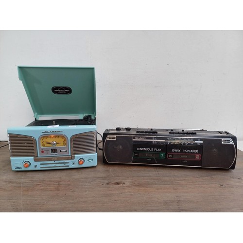 709 - Two items, one Sharp WQ-268E portable stereo four-band radio/twin cassette recorder and one Murphy T... 