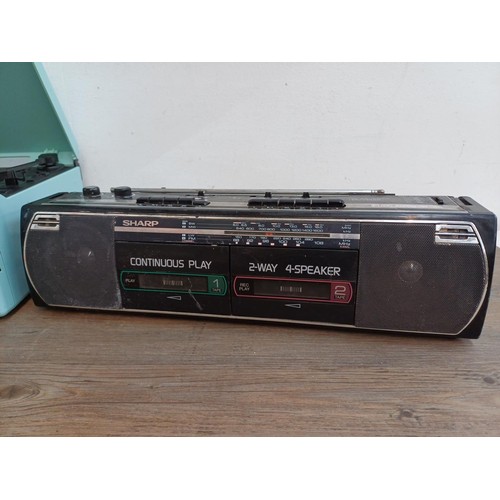 709 - Two items, one Sharp WQ-268E portable stereo four-band radio/twin cassette recorder and one Murphy T... 