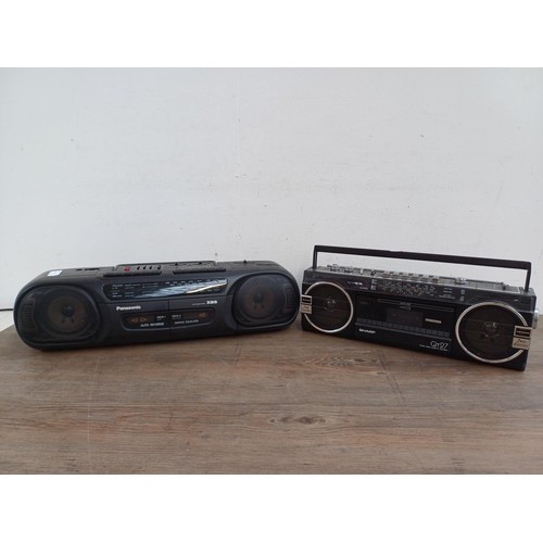 710 - Two portable stereo four-band radio cassette players, one Panasonic RX-FT570 and one Sharp QT-27E