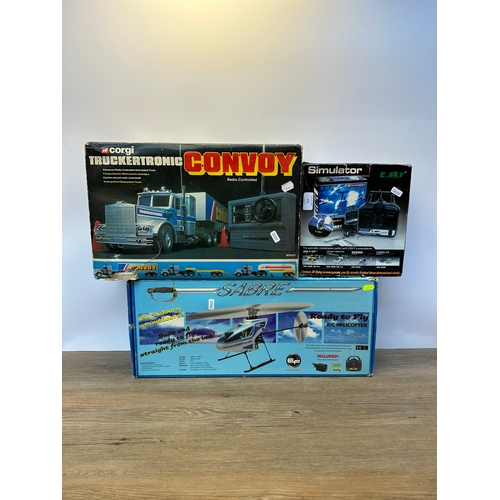 471 - Three boxed remote control vehicles, one E Sky helicopter, one Sabre helicopter and one Corgi Trucke... 