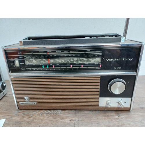 711 - Two vintage Grundig four-band portable radios, one Elite-Boy 600 and one Yacht-Boy 210 with instruct... 