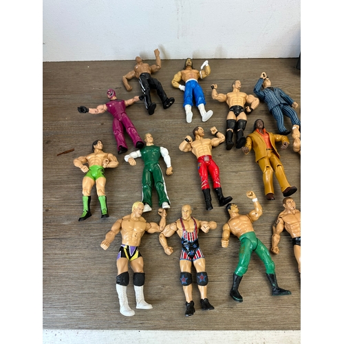 476 - A large collection of WWE action figurines together with WWE Cruiserweight Champion belt