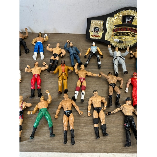 476 - A large collection of WWE action figurines together with WWE Cruiserweight Champion belt