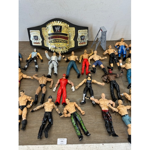 476 - A large collection of WWE action figurines together with WWE Cruiserweight Champion belt