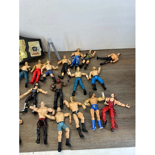 476 - A large collection of WWE action figurines together with WWE Cruiserweight Champion belt