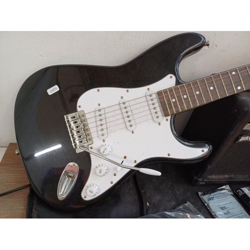 776 - A Rock Jam electric guitar package comprising Stratocaster style electric guitar, GA-20W practice am... 