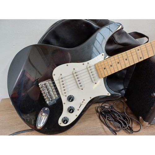 777 - Two items, one cased Behringer Stratocaster electric guitar with cable and one Cruiser by Crafter CR... 