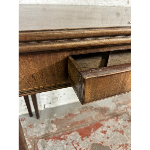 195 - A George III mahogany fold-over tea table - approx. 72cm high x 91cm wide x 89cm long when extended