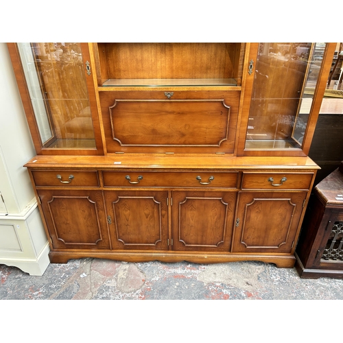 212 - A Bradley yew wood display cabinet - approx. 185cm high x 166cm wide x 40cm deep