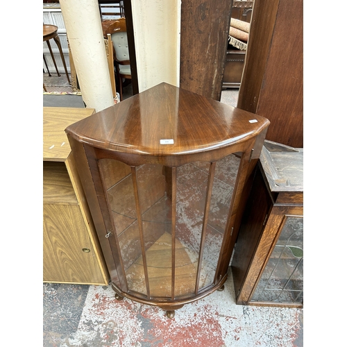 216 - A walnut bow front corner display cabinet with cabriole supports - approx. 115cm high x 65cm wide x ... 