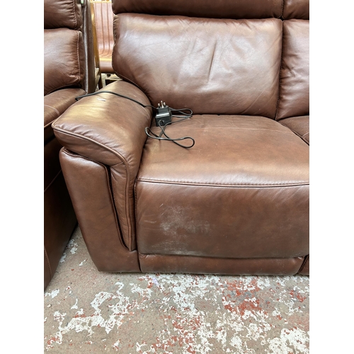 219 - A Violino brown leather electric reclining two seater sofa with power adapter - approx. 103cm high x... 