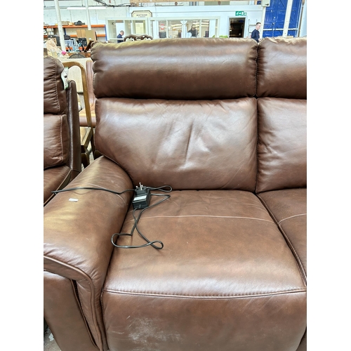 219 - A Violino brown leather electric reclining two seater sofa with power adapter - approx. 103cm high x... 