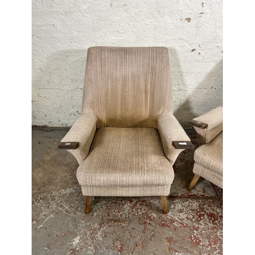 223 - A pair of mid 20th century fabric upholstered and beech armchairs