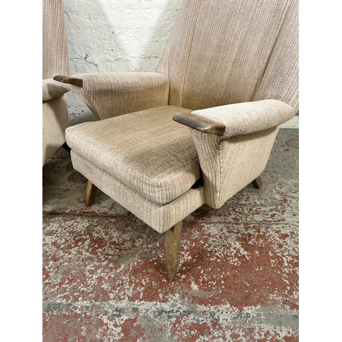 223 - A pair of mid 20th century fabric upholstered and beech armchairs