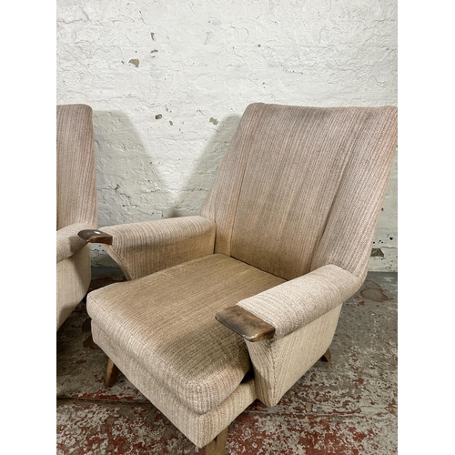 223 - A pair of mid 20th century fabric upholstered and beech armchairs