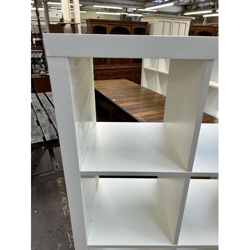 231 - An IKEA Kallax white laminate shelving unit - approx. 150cm high x 79cm wide x 39cm deep