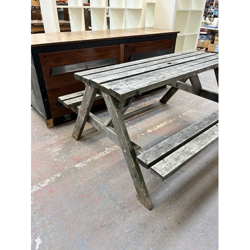 233 - A pine picnic bench - approx. 76cm high x 128cm wide x 149cm long