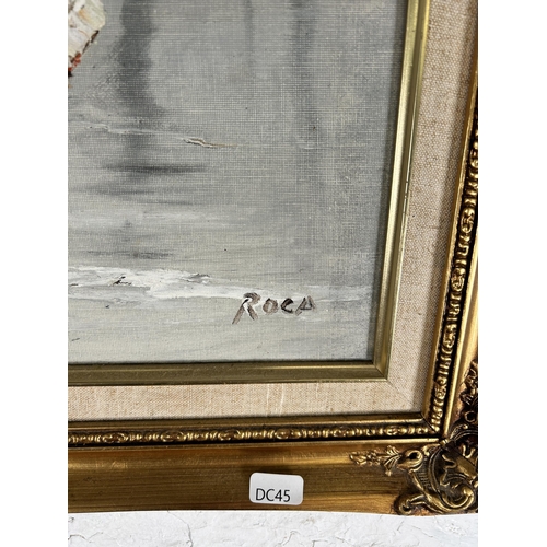 234 - A gilt framed oil on board signed Roca - approx. 63cm high x 73cm wide