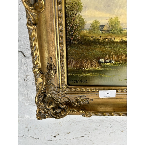 236 - A gilt framed H. Sanders oil on canvas of a landscape scene - approx. 55cm high x 65cm wide