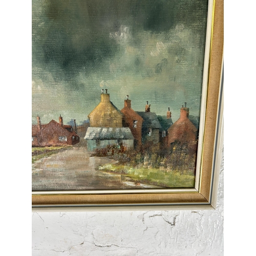 243 - A mid 20th century framed oil on board of a northern town scene, signed A. G. Wale - approx. 35cm hi... 