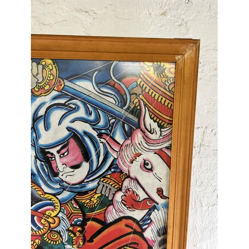 250 - A framed Japanese kite picture - approx. 76cm high x 61cm wide