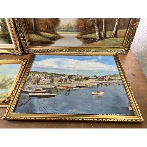 251 - Four gilt framed oil paintings - largest approx. 71cm high x 102cm wide