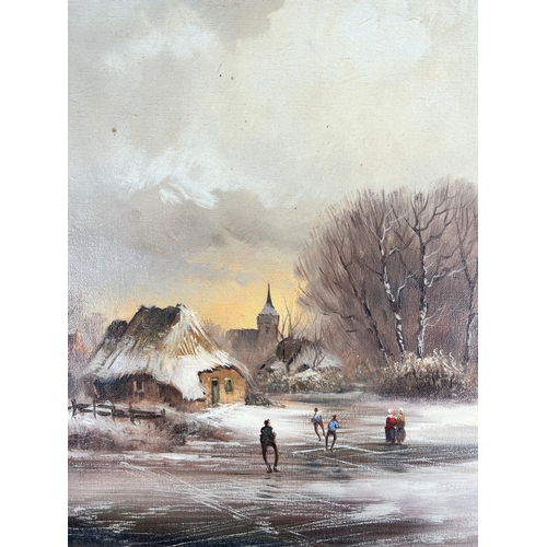 282 - A gilt framed oil on canvas of a winter landscape scene, signed lower right - approx. 65cm high x 75... 