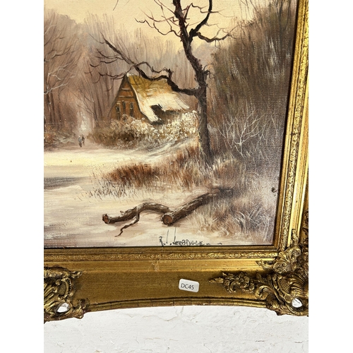 282 - A gilt framed oil on canvas of a winter landscape scene, signed lower right - approx. 65cm high x 75... 