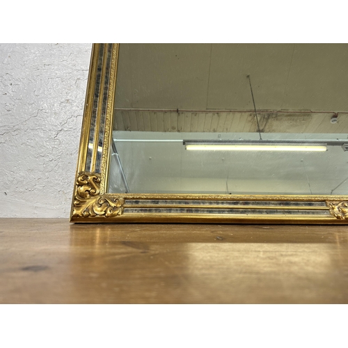 283 - A 19th century style gilt framed wall mirror - approx. 89cm high x 127cm wide