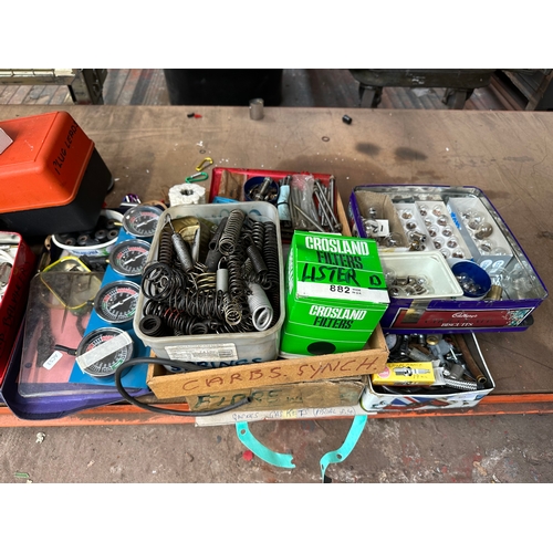 911 - A large collection of tools and motorcycle parts to include carburetor synchronizer, boxed Crosland ... 