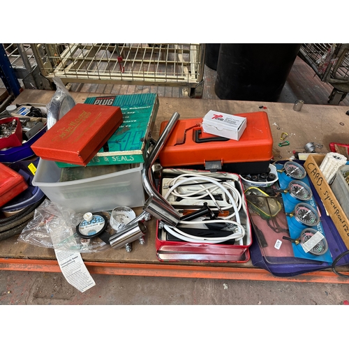 911 - A large collection of tools and motorcycle parts to include carburetor synchronizer, boxed Crosland ... 