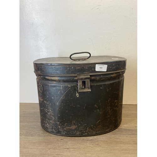 423 - Two late 19th/early 20th century metal storage boxes, one hat box and one dome top