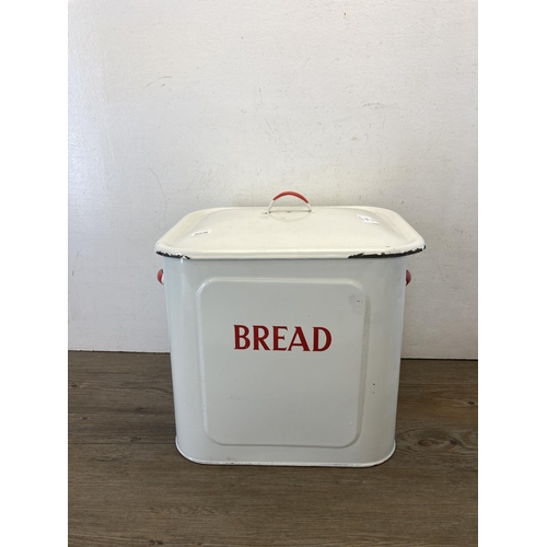 425 - Two mid 20th century enamelled items, one lidded bread bin and one milk can - bread bin approx. 35cm... 