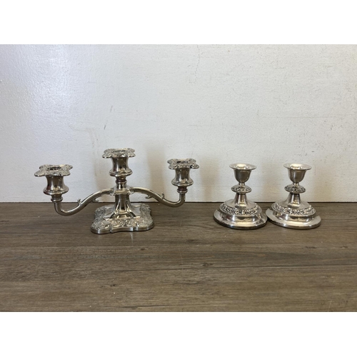 427 - Ten pieces of silver plated ware to include Unett plate three piece tea set, two branch candelabra, ... 