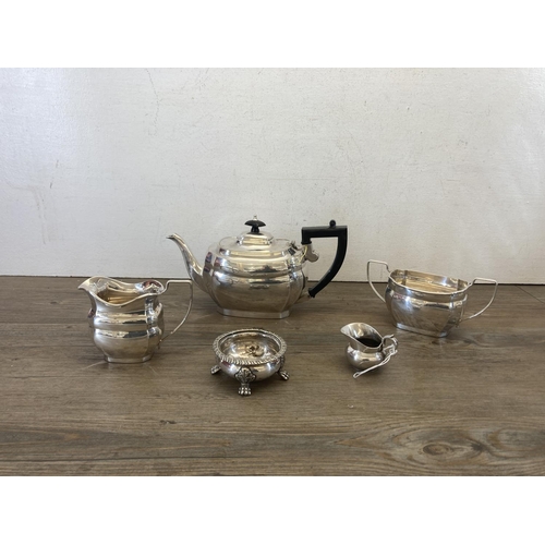 427 - Ten pieces of silver plated ware to include Unett plate three piece tea set, two branch candelabra, ... 