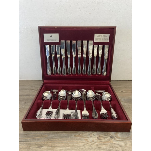 432 - Two cased stainless steel cutlery sets, one Firth Staybrite and one Viners 15 piece service for eigh... 