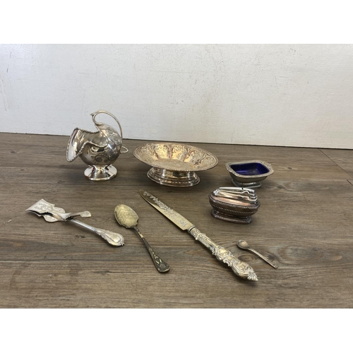 438 - A collection of antique and later metalware to include Art Nouveau silver plated candle holder, Vine... 