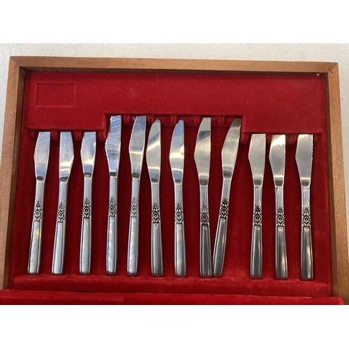 446 - A mid 20th century teak cased Viners stainless steel cutlery set