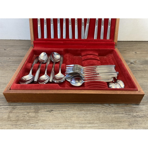 446 - A mid 20th century teak cased Viners stainless steel cutlery set