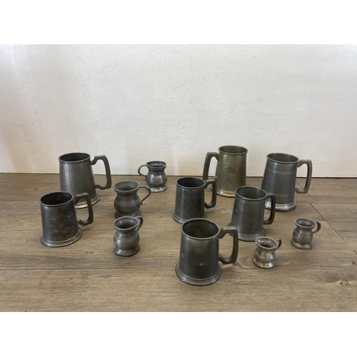 458 - A collection of 19th century and later metalware to include pewter graduating tankards with makers m... 