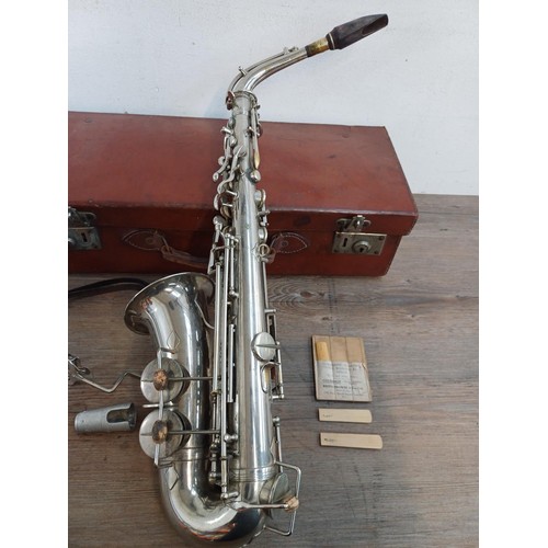 782 - A cased early 20th century French Jérôme Thibouville-Lamy 'Special Class' alto saxophone with wooden... 