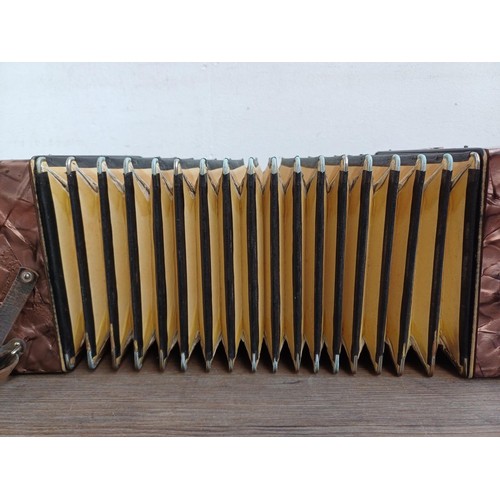 785 - A cased vintage Hohner Club III diatonic three-row button melodeon with music books