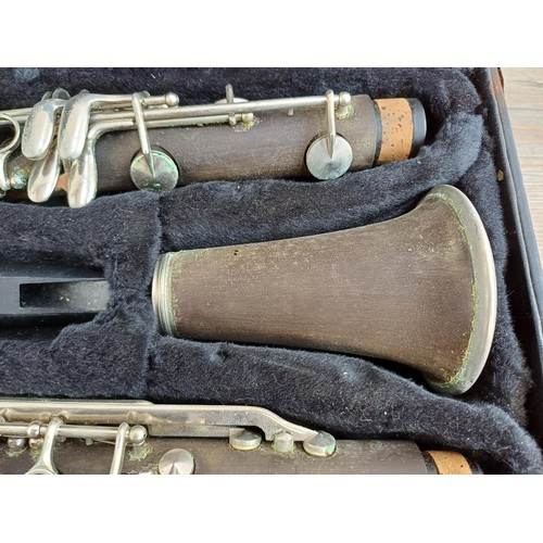 790 - Two cased clarinets, one incomplete