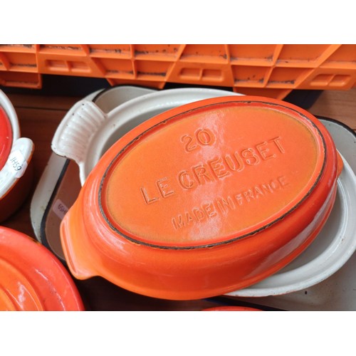 847 - A large collection of enamelled cast iron cookware to include Cousances, Le Creuset and Nacco